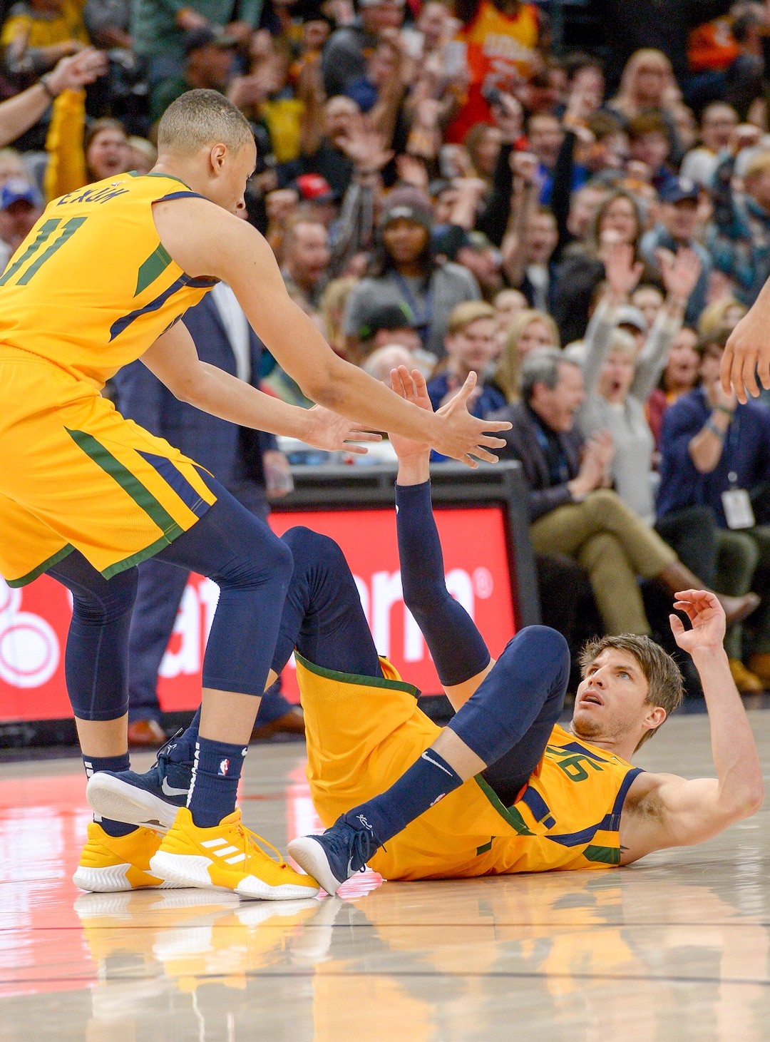 Leah Hogsten  |  The Salt Lake Tribune  Utah Jazz guard Kyle Korver (26) is helped to his feet by teammate Utah Jazz guard Dante Exum (11) after sinking a 3-pointer as the Utah Jazz host the Philadelphia 76ers at Vivint Smart Home Arena, Thursday, December 27, 2018. 