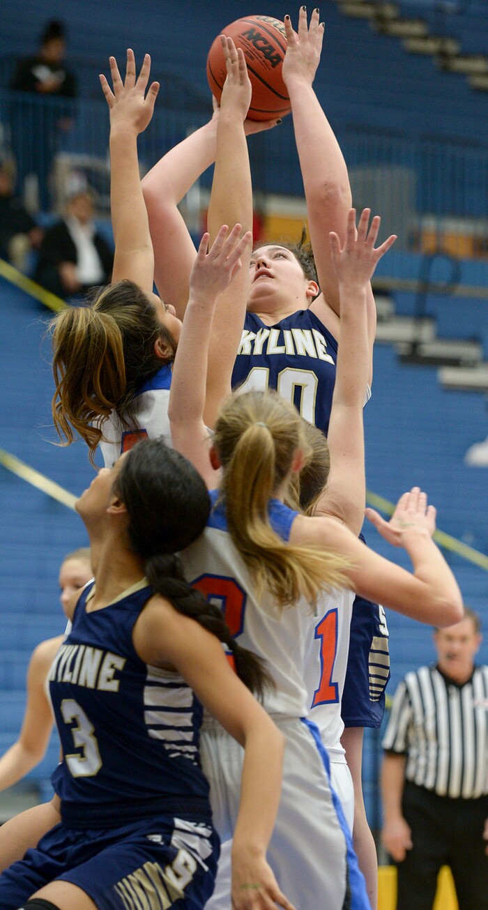 (Leah Hogsten  |  The Salt Lake Tribune)  Skyline's Cameron Mooney (40) hits the net. Timpview faces Skyline in their semifinal game of the 5A High School Girls' Basketball Tournament at SLCC in Taylorsville, Friday, Feb. 23, 2018. 