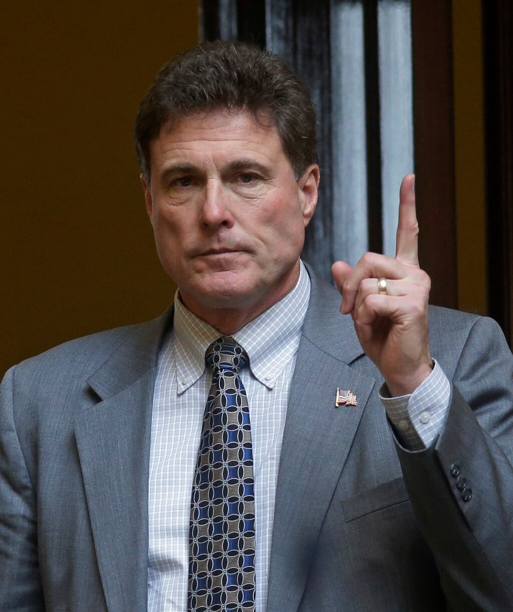 This Feb. 25, 2015 file photo shows Taylorsville Republican Rep. Jim Dunnigan voting on the house floor at the Utah State Capitol, in Salt Lake City. A Utah doctors' group is speaking out against lawmakers' plan to have doctors, hospitals and others pay most of the cost of expanding the state's Medicaid rolls. Herbert and Republican legislative leaders say doctors and other practitioners would benefit from having more patients covered by Medicaid and they should help pay the $78 million price tag to insure more of Utah's poor. (AP Photo/Rick Bowmer, File)