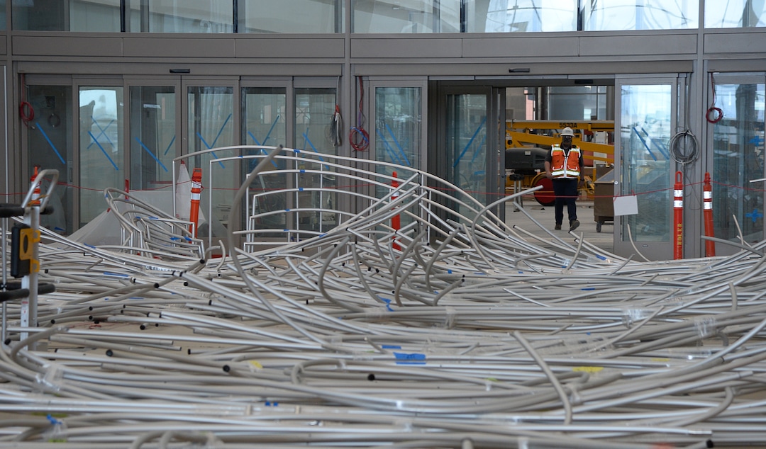 (Francisco Kjolseth  |  The Salt Lake Tribune) The area known as The Canyon begins to take shape with crews stretching fabric over metal fins to simulate southern Utah canyon walls during the first phase of construction of the Salt Lake City International Airport on Wednesday, May 20, 2020.
