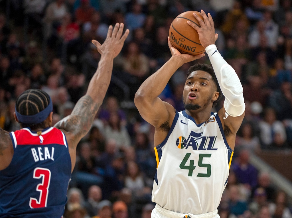(Rick Egan  |  The Salt Lake Tribune)    Utah Jazz guard Donovan Mitchell (45) shoots over Washington Wizards guard Bradley Beal (3), in NBA action between the Utah Jazz and the Washington Wizards, in Salt Lake City, Friday, February 28, 2020