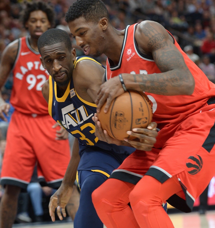 (Leah Hogsten  |  The Salt Lake Tribune) Utah Jazz center Ekpe Udoh (33) tries to get the rebound from Toronto Raptors guard Delon Wright (55). The Utah Jazz lead the Toronto Raptors 54-53 at Vivint Smart Home Arena, Friday, November 3, 2017