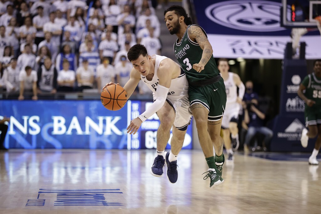BYU's Alex Barcello is bumped by a Cleveland State player in both teams' season opener at the Marriott Center in Provo on Tuesday, Nov. 9, 2021. Barcello led all scorers with 24 points.