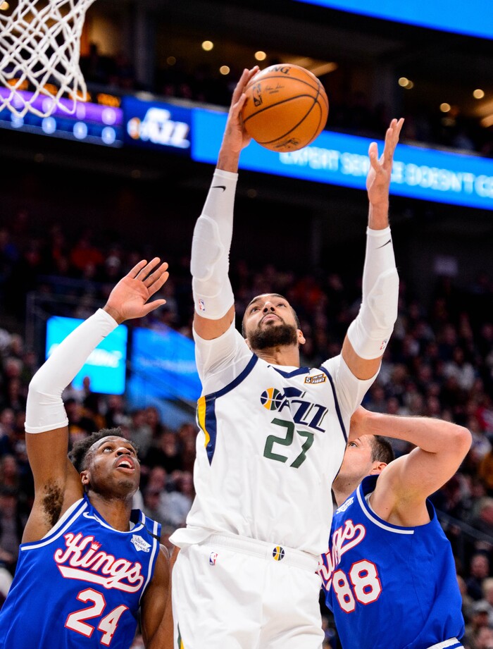 (Trent Nelson  |  The Salt Lake Tribune) Utah Jazz center Rudy Gobert (27) grabs a rebound flanked by Sacramento Kings guard Buddy Hield (24) and Sacramento Kings forward Nemanja Bjelica (88)  the Utah Jazz host the Sacramento Kings, NBA basketball in Salt Lake City on Saturday, Jan. 18, 2020.