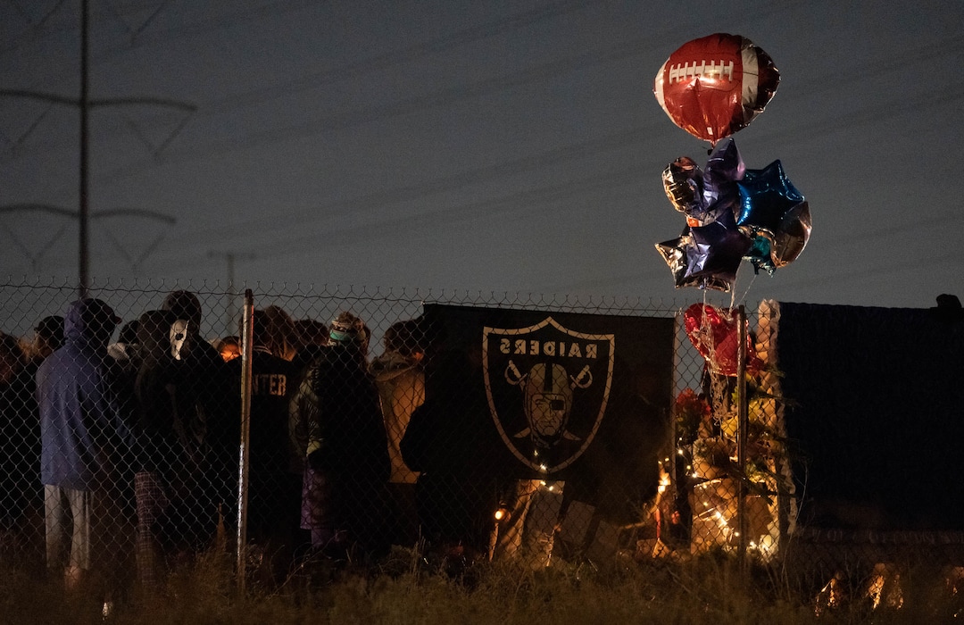 (Francisco Kjolseth | The Salt Lake Tribune) More that a hundred people gather at the candlelight vigil of Hunter High football players Paul Tahi , 15, Tivani Lopati, 14, and Ephraim Asiata, 15, on Friday, Jan 14, 2022, in West Valley City, near Hunter High School along 1400 South at Mountain View Corridor. Paul Tahi and Tivani Lopati were killed in a shooting, while Ephraim Asiata remains in critical condition.