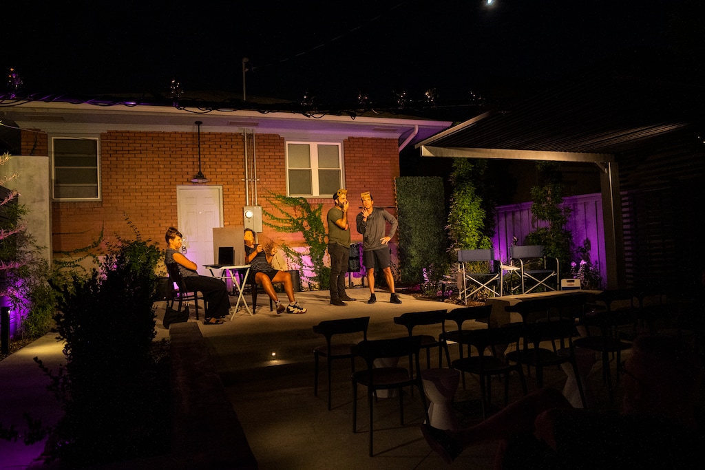 (Rick Egan | The Salt Lake Tribune) From left, Brenda Hattingh Peatross, Tamara Howell, Josh Richardson and Calbert Beck during rehearsal for the play "June to August" at Meanwhile Park in Salt Lake City on Tuesday, July 25, 2023. A Salt Lake City man has created an outdoor theater space in his backyard and is producing a new romantic comedy by Utah playwright Matthew Ivan Bennet.