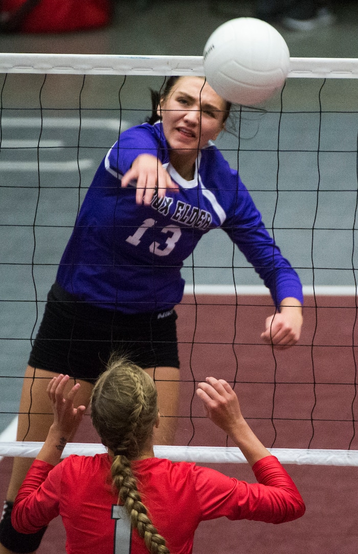 (Rick Egan  |  The Salt Lake Tribune)  Box Elder Bees Shayna Baugh (13) hits the ball past Bountiful Braves Baylee Mittelstaedt (1), in 5A volleyball championship game, Bountiful vs. Box Elder, at Utah Valley University, Saturday, November 4, 2017.