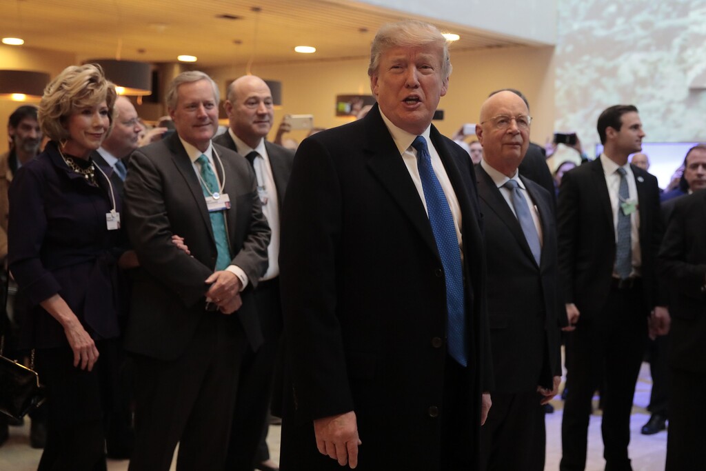 President Donald Trump (center) arrives at the World Economic Forum in Davos, Switzerland, on Jan. 25, 2018. (Jason Alden | Bloomberg)