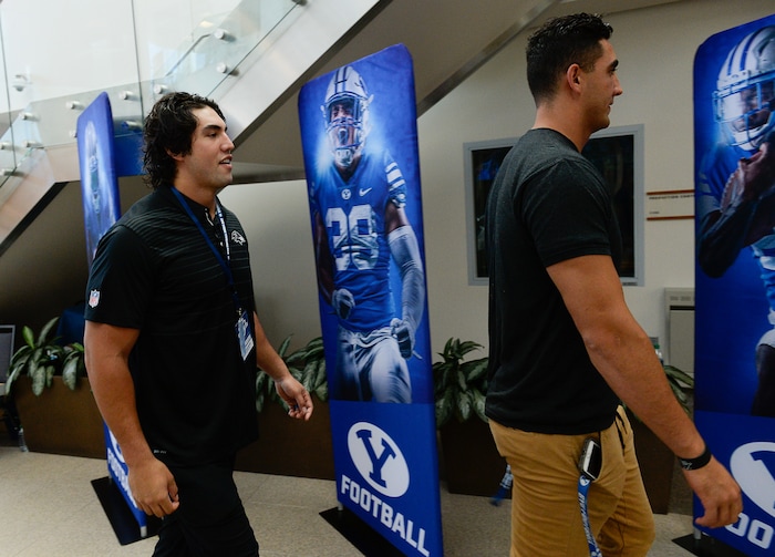 (Francisco Kjolseth  |  The Salt Lake Tribune)  Former BYU football player Bronson Kaufusi, left, with the Baltimore Ravens joins this brother Corbin, currently playing for BYU as during the eighth-annual football media day at the BYU-Broadcasting Building on Friday, June 22, 2018.