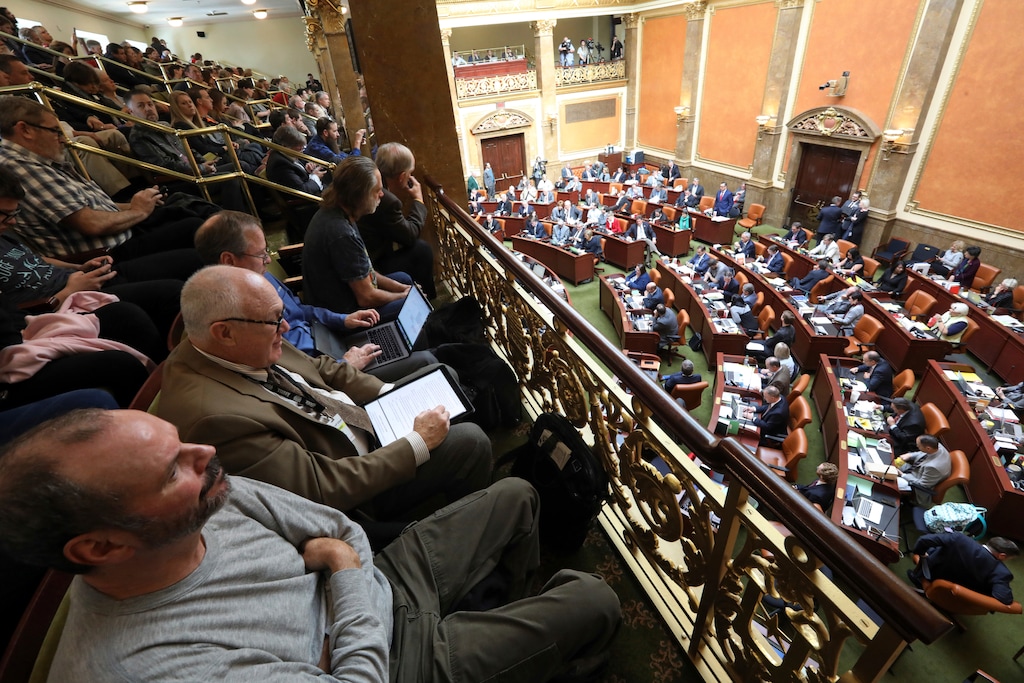 People look on as the Utah Legislature went into session Monday, Dec. 3, 2018, in Salt Lake City. Utah lawmakers are meeting to consider changes to a voter-approved ballot initiative legalizing medical marijuana in a move that has generated backlash among supporters of the pot measure. (AP Photo/Rick Bowmer)