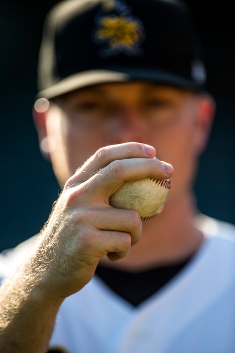 (Chris Detrick  |  The Salt Lake Tribune)    Salt Lake Bees pitcher Daniel Wright shows off his curveball grip at Smiths Ballpark.