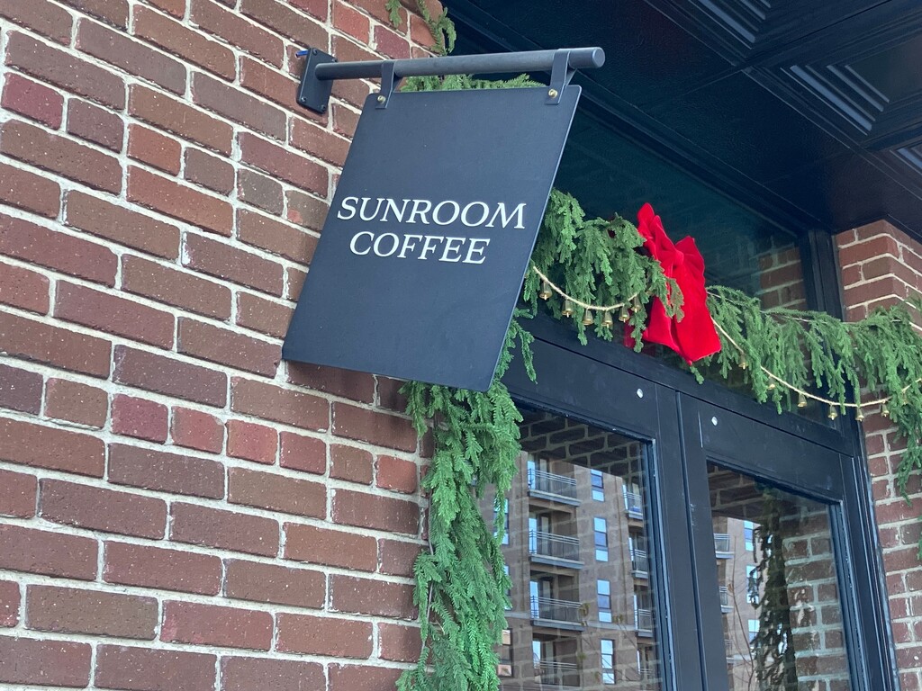 (Sean P. Means  |  The Salt Lake Tribune) The slightly askew sign at Sunroom Coffee, a cafe near downtown Salt Lake City that was vandalized on Christmas.