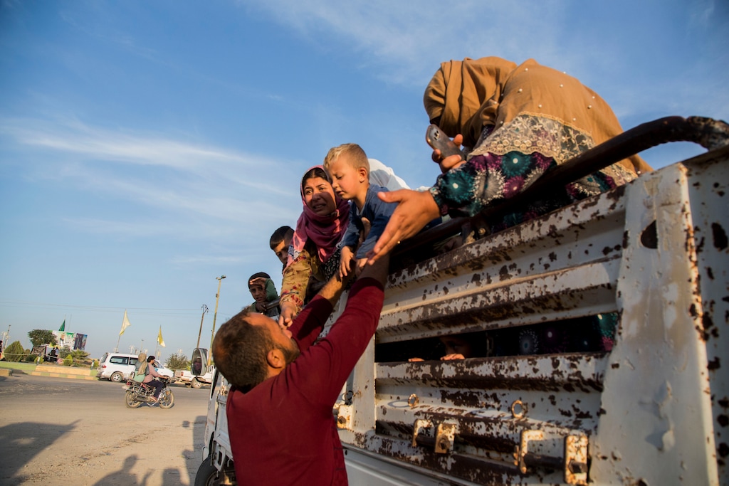 (Baderkhan Ahmad | AP) Syrians fleeing Turkish advance arrive to the town of Tal Tamr in north Syria, Monday, Oct. 14, 2019. Syrian government troops moved into towns and villages in northern Syria on Monday, setting up a potential clash with Turkish-led forces advancing in the area as long-standing alliances in the region begin to shift or crumble following the pullback of U.S. forces.