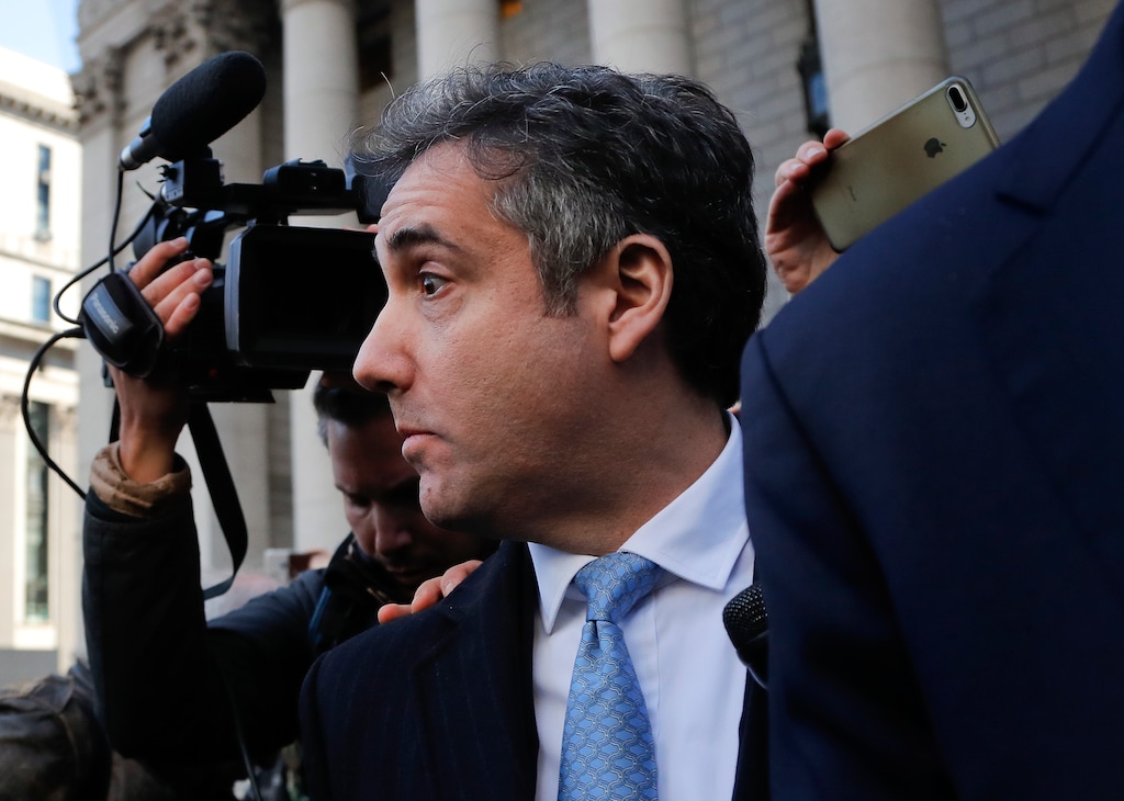 Michael Cohen walks out of federal court, Thursday, Nov. 29, 2018, in New York, after pleading guilty to lying to Congress about work he did on an aborted project to build a Trump Tower in Russia. Cohen told the judge he lied about the timing of the negotiations and other details to be consistent with Trump's "political message." (AP Photo/Julie Jacobson)
