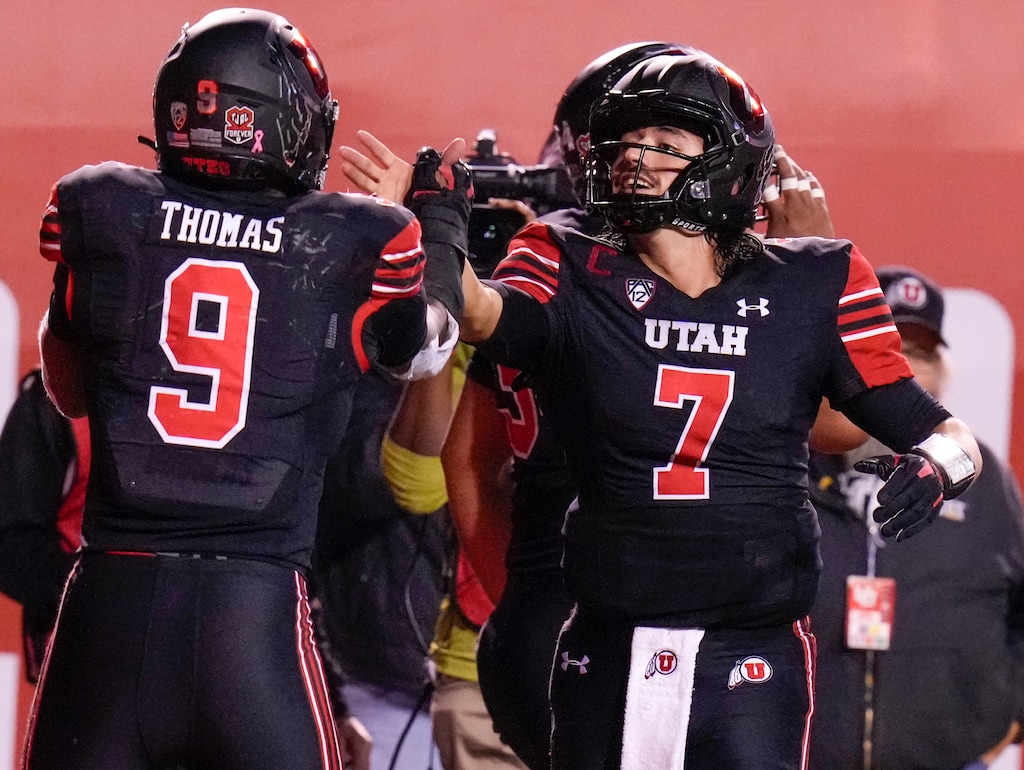 (Leah Hogsten | The Salt Lake Tribune)  Utah Utes running back Tavion Thomas (9) celebrates his touchdown with Utah Utes quarterback Cameron Rising (7) in the second half as the University of Utah hosts the UCLA Bruins in Pac-12 football, Saturday, Oct. 30, 2021 at Rice-Eccles Stadium. 