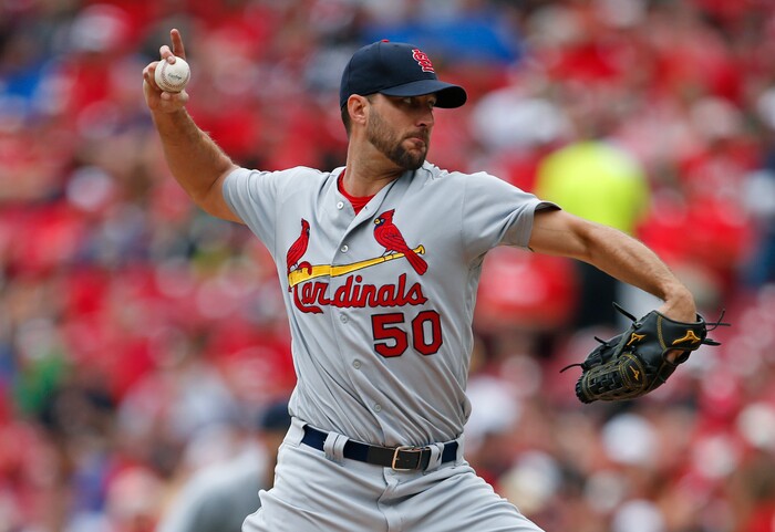 St. Louis Cardinals starting pitcher Adam Wainwright (50) throws against the Cincinnati Reds during the first inning of a baseball game, Sunday, Aug. 6, 2017, in Cincinnati. (AP Photo/Gary Landers)