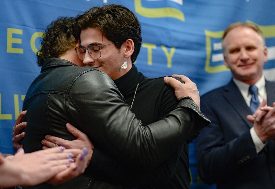 (Francisco Kjolseth  |  The Salt Lake Tribune) Justin Utley, left, and Nathan Dalley, both survivors of conversion therapy, embrace after Dalley spoke on his painful and harmful experiences that he considered the worst days of his life. Equality Utah held a press conference at the Utah Capitol on Wednesday, Jan. 22, 2020, to recognize Utah becoming the 19th state in the nation to enact a ban on conversion therapy for minors. At right is Rep. Craig Hall, R-West Valley, was the sponsor of the bill that helped prohibit conversion therapy.