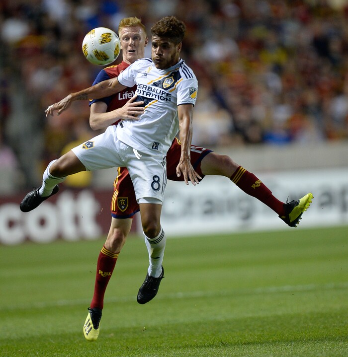 (Francisco Kjolseth  |  The Salt Lake Tribune)  Real Salt Lake defender Justen Glad (15) and Los Angeles Galaxy midfielder Jonathan dos Santos (8) battle it out during the first half of the MLS soccer match Saturday, Sept. 1, 2018, in Sandy at Rio Tinto Stadium.