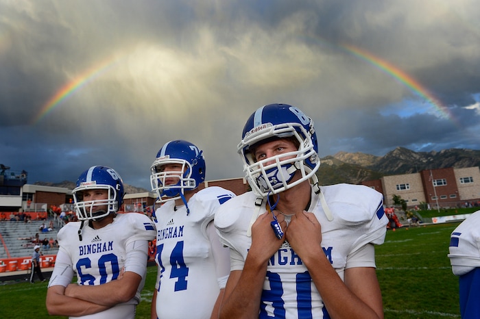 (Scott Sommerdorf  |  The Salt Lake Tribune)  Bingham players during pre-game warm ups under a rainbow as Brighton hosted rival Bingham in a 5A game played Friday, September 26, 2014.