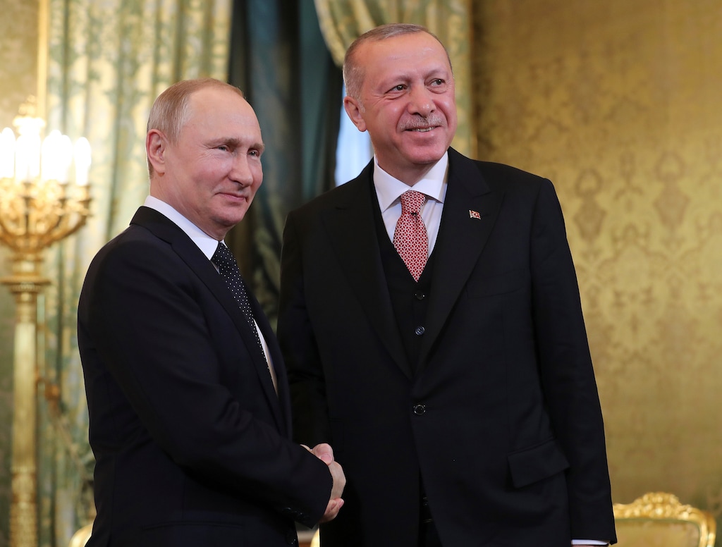 Russia's President Vladimir Putin, left, shakes hands with Turkey's President Recep Tayyip Erdogan as he welcomes him prior to their meeting in Moscow, Russia, Monday, April 8, 2019. Russian President Vladimir Putin is hosting his Turkish counterpart, Recep Tayyip Erdogan, for talks expected to focus on the situation in Syria and their two nations' booming economic ties. (Presidential Press Service via AP, Pool)