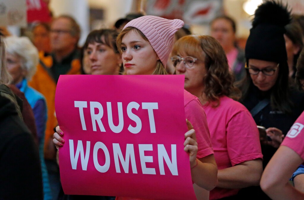 Activists gathers with others in the Utah State Capitol Rotunda to protest abortion bans happening in Utah and around the country Tuesday, May 21, 2019, in Salt Lake City. State law makers recently passed a ban on abortions after 18 weeks, but have agreed not to enforce the ban as a court challenge plays out. (AP Photo/Rick Bowmer)