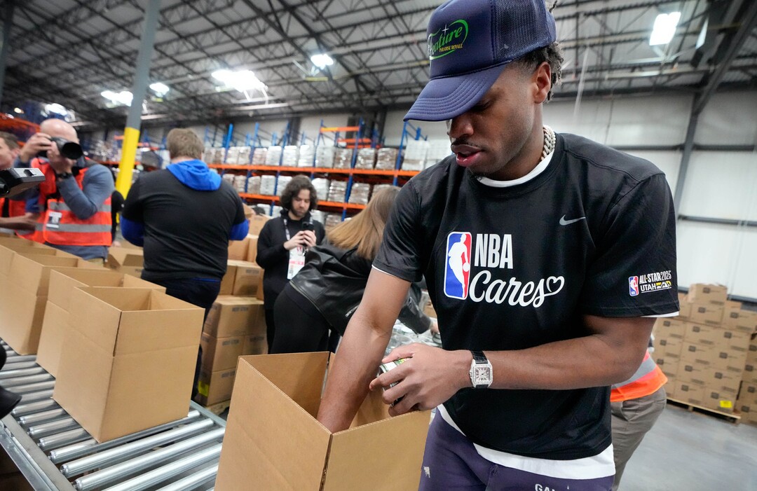 (Francisco Kjolseth | The Salt Lake Tribune) Buddy Hield from the Indiana Pacers packs boxes with food during the NBA Cares Day of Service in Salt Lake City on Feb. 17, 2023.