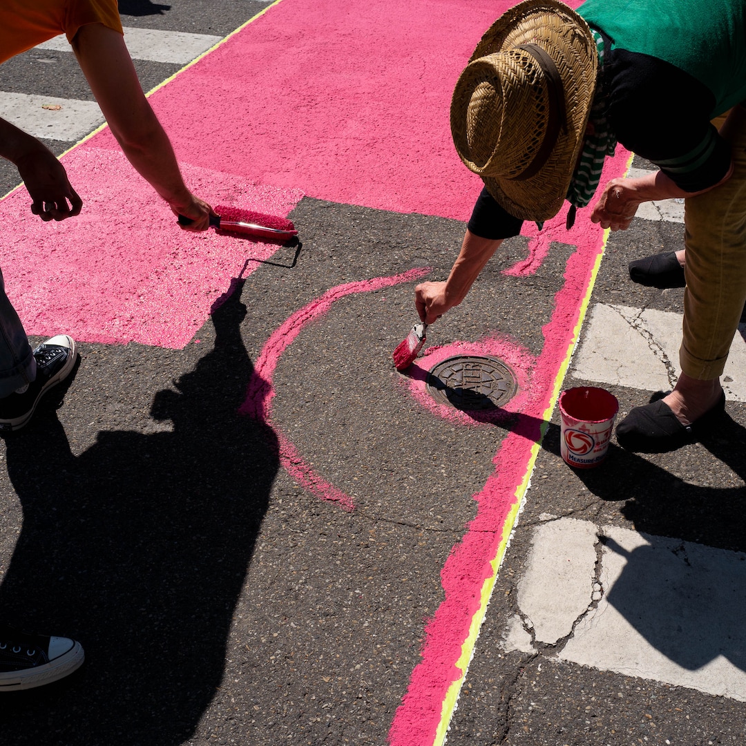(Trent Nelson  |  The Salt Lake Tribune)  Jann Haworth, right, working on her Rose art project on Broadway in Salt Lake City on Sunday Aug. 11, 2019.