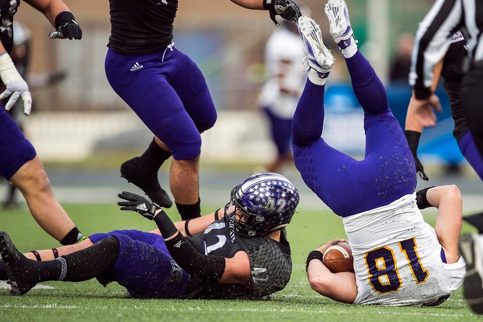 (Chris Detrick  |  The Salt Lake Tribune)  Weber State Wildcats defensive lineman Adam Rodriguez (42) tackles Western Illinois Leathernecks quarterback Sean McGuire (18) during the game at Stewart Stadium Saturday, November 25, 2017.  