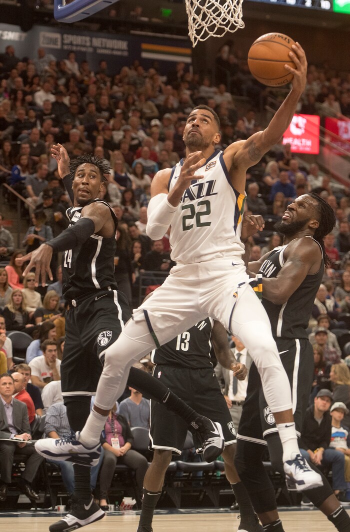 (Rick Egan  |  The Salt Lake Tribune) Utah  forward Thabo Sefolosha (22) goes under neath the basket as he attempts a shot for the Jazz, in NBA action, Utah Jazz vs. Brooklyn Nets, in Salt Lake City, Saturday, November 11, 2017.