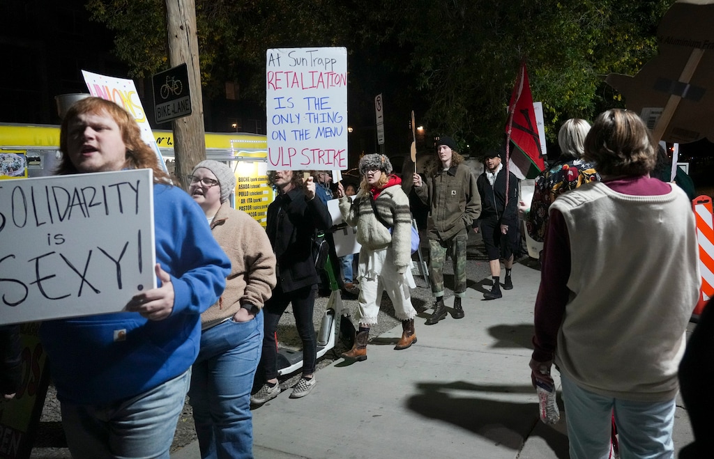 (Bethany Baker | The Salt Lake Tribune) Members of SunTrapp Workers United (SWU) and their allies picket in front of The SunTrapp in Salt Lake City on Friday, Oct. 24, 2025. A week later, on Friday, Oct. 31, 2025, the bar announced it was closing, citing the financial impact of the protests. Workers had asked the bar to voluntarily recognize the union and alleged they had been retaliated against by management.