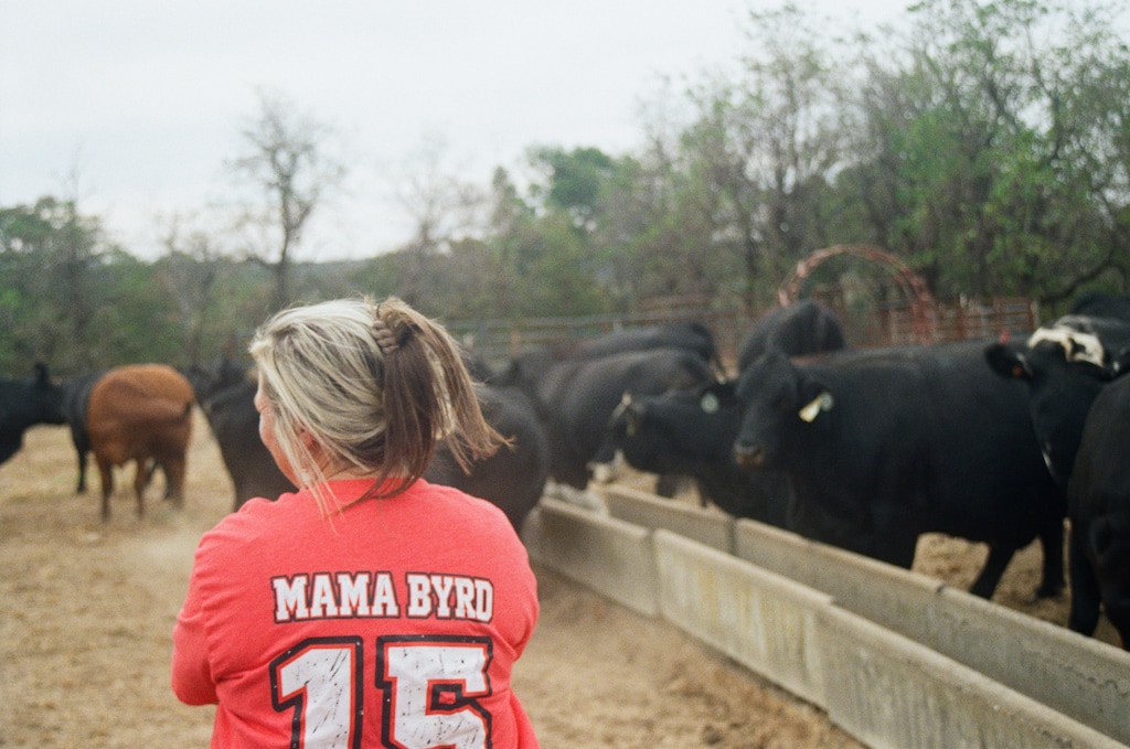 (Joel Rayburn | Special to The Salt Lake Tribune) Byrd Ficklin's mother, Brandy Ridley, looks on at her feeding cows at her farm in Oktaha, Oklahoma.