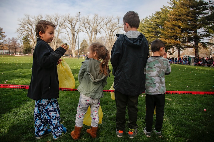 (Nicole Boliaux | For The Tribune) Children wait for the stroke of 9 o'clock to begin the annual Easter egg hunt put on by A Kid's Place Dentistry in Liberty Park in Salt Lake City on Saturday, March 31, 2018.