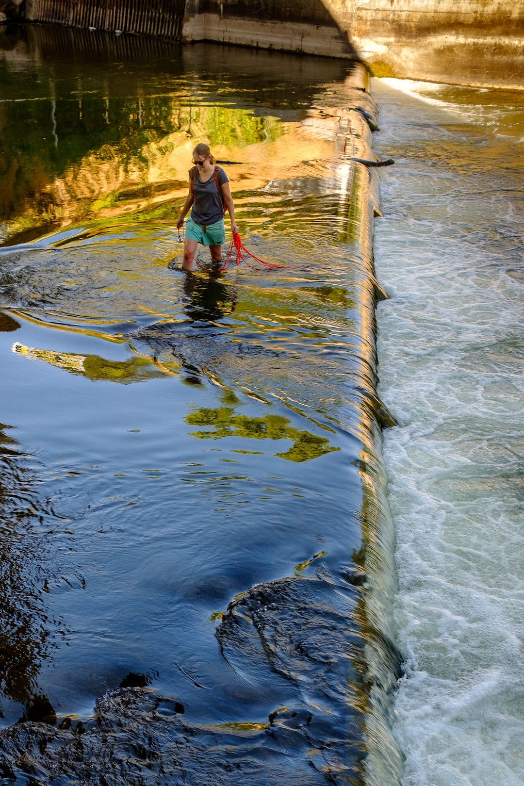(Trent Nelson  |  The Salt Lake Tribune)  
Jessica Miller magnet fishing the Weber River on Saturday Aug. 31, 2019. Volunteers assisted the Utah Cold Case Coalition, hoping to find evidence in several cases.