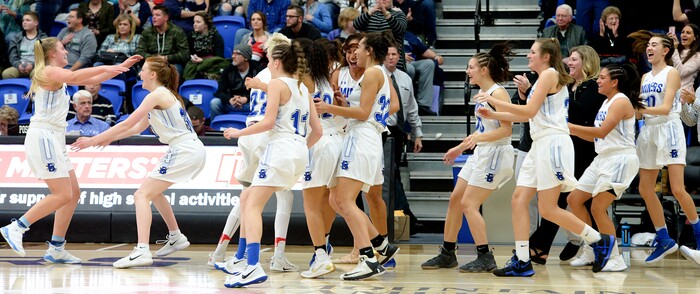(Leah Hogsten  |  The Salt Lake Tribune) Bingham's head coach Charron Mason and the team celebrate the win.  Bingham defeated Copper Hills 48-40 in their semifinal game of the 6A High School Girls' Basketball Tournament at SLCC in Taylorsville, Friday, Feb. 23, 2018. 