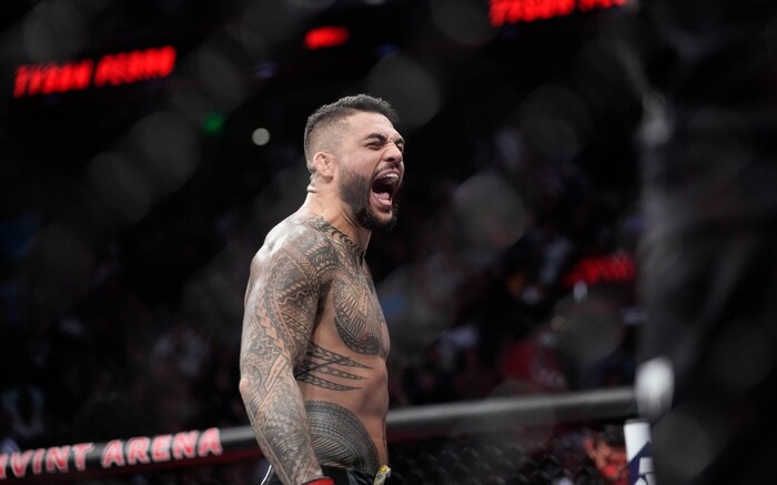 (Francisco Kjolseth | The Salt Lake Tribune) Tyson Pedro of Australia celebrates his quick win in the first round over Harry Hunsucker of the United States in UFC 278 during their mixed martial arts bout in the octagon in Salt Lake City on Saturday, Aug. 20, 2022.  
