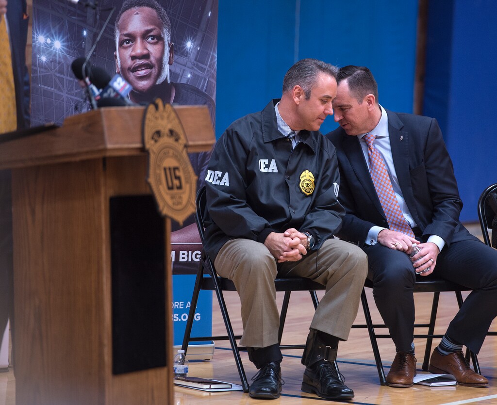 (Leah Hogsten  |  The Salt Lake Tribune) l-r Utah DEA agent Brian Besser talks with Utah House of Representatives speaker Greg Hughes during the event held at the Boys and Girls Club. The Drug Enforcement Agency unveiled a new strategy to combat opioid abuse. The DEA 360 Strategy will be a comprehensive approach involving law enforcement, drug manufacturers, doctors, pharmacists and educational programs for schools and social media platforms.