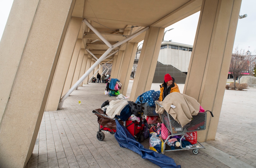 (Rick Egan  |  The Salt Lake Tribune)    People are forced to pack up their belongings in carts and wagons near the Salt Lake City library,  Monday, Dec. 23, 2019.