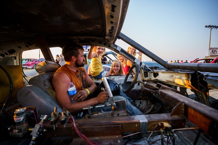 (Trent Nelson  |  The Salt Lake Tribune) Zeb Hansen gets a sendoff from his family before competing at Punishment at the Peak, a demolition derby in Grantsville on Saturday, Aug. 7, 2021.