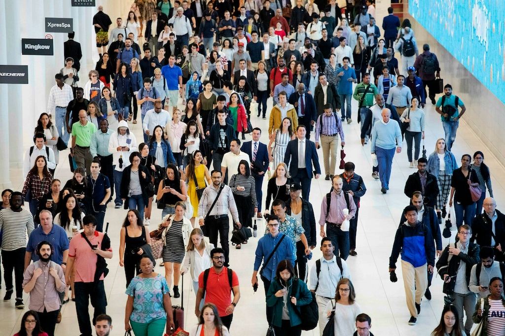 (Mark Lennihan, AP) In this June 21, 2019, file photo commuters walk through a corridor in the World Trade Center Transportation Hub in New York. Many employees who left their companies during the pandemic have since returned to their former employers.
