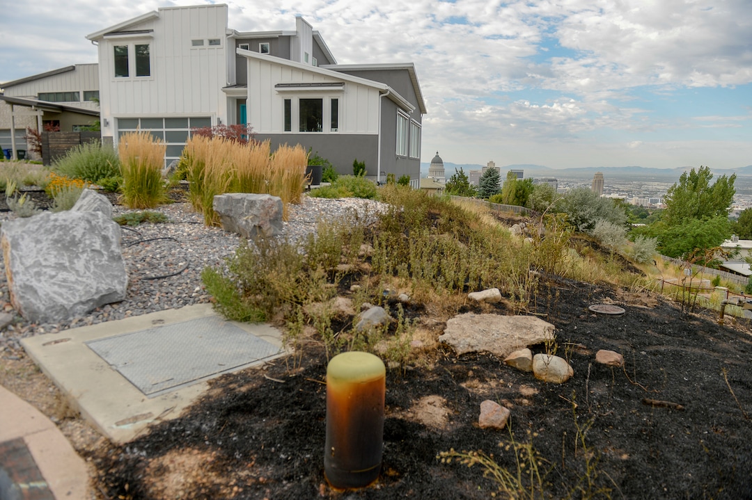 Leah Hogsten  |  The Salt Lake Tribune  Five people were injured and one home was damaged by a fast-moving grass fire on Columbus Court, Tuesday, July 24, 2018. Forty homes were evacuated as flames spread through about 100 acres. Between 50 and 60 firefighters responded to the fire.