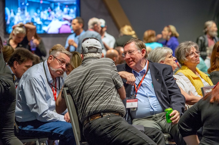 (Leah Hogsten | The Salt Lake Tribune) l-r Central Committee members Byard Kershaw, Jimi Kestin and Nick Lang chat during a break in the agenda. The Utah Republican Party Central Committee meets Saturday, May 19, 2018, to elect a new party vice chairman and debate several potential bylaw changes.