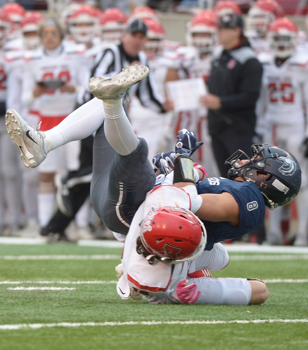 (Leah Hogsten  |  The Salt Lake Tribune) Corner CanyonÕs Noah Kjar is brought down by American ForkÕs Stockton Eggett. Corner Canyon High School takes on American Fork High School during the 6A State Championship football title, Nov. 22, 2019 at Rice-Eccles Stadium.