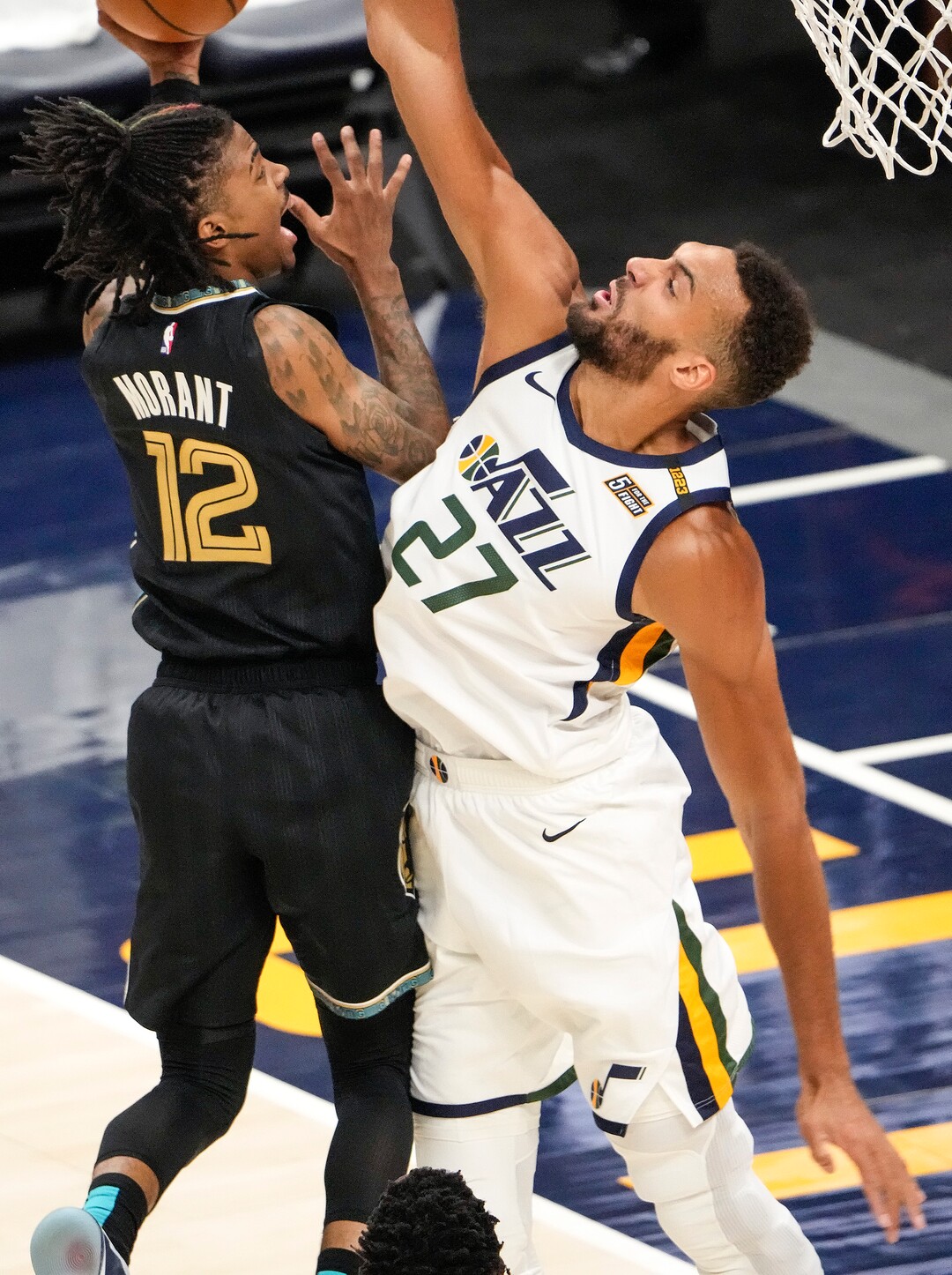 (Leah Hogsten | The Salt Lake Tribune) Utah Jazz center Rudy Gobert (27) denies Memphis Grizzlies guard Ja Morant (12) at the net as the Utah Jazz take on the Memphis Grizzlies during Game 1 of the first-round playoffs at Vivint Arena, May 23, 2021.