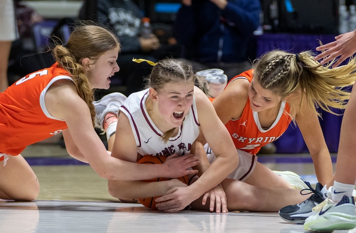 (Rick Egan | The Salt Lake Tribune) Skyridge guard Cambree Blackham (5) goes after a loose ball along with Kennedy Woolston, Lone Peak and Shae Tooele (2) in the 6A girls Championship Game between Skyridge and Lone Peak, at Weber State, on Saturday, March 4, 2023.
