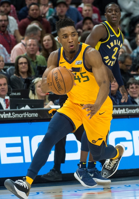 (Rick Egan  |  The Salt Lake Tribune) Utah Jazz guard Donovan Mitchell (45) picks up a loose ball and dribbles around Indiana Pacers guard Darren Collison (2) and goes coast-to-coast to score for the Jazz, in NBA action Utah Jazz vs Indiana Pacers, in Salt Lake City, Monday, January 15, 2018.