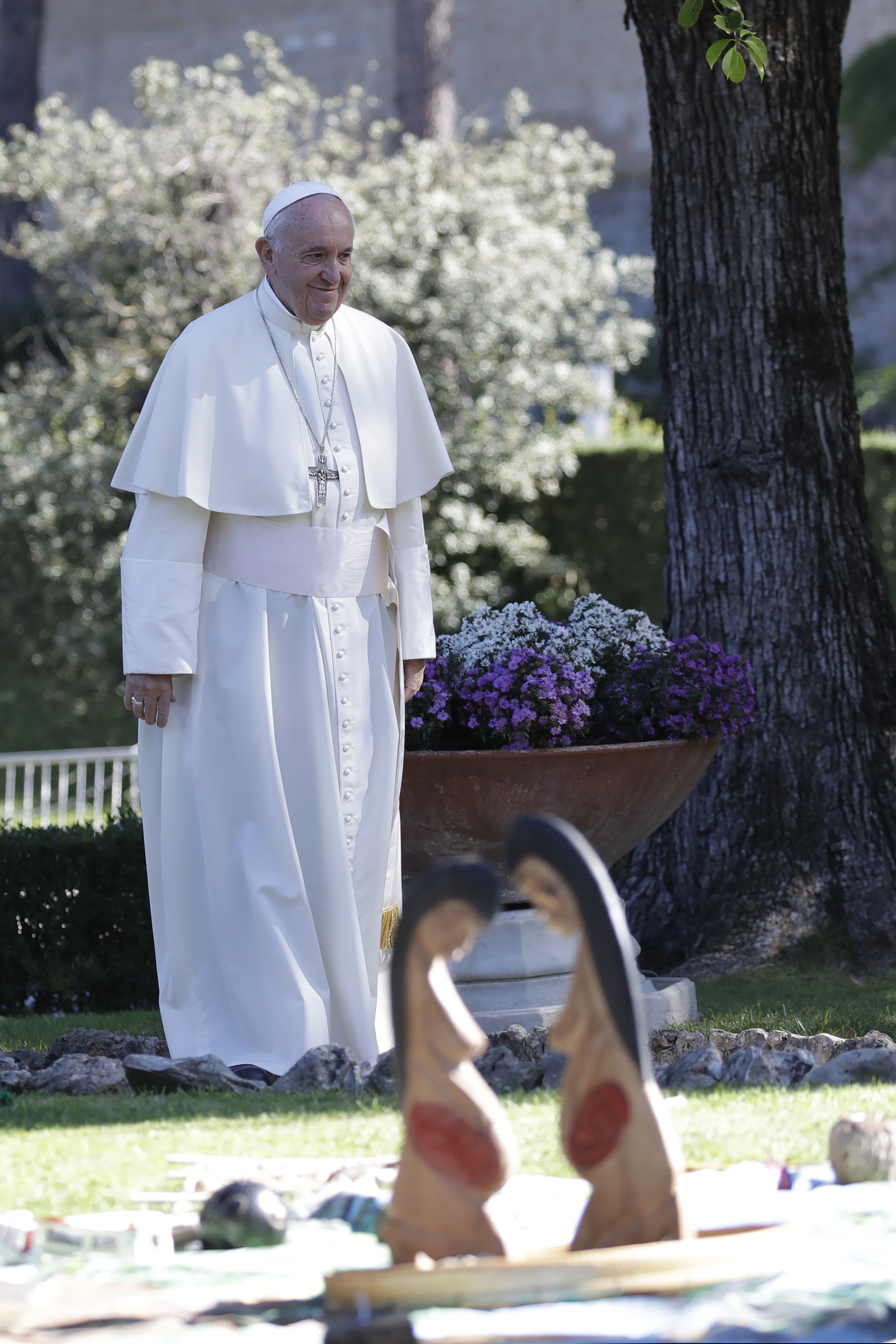 (AP Photo/Alessandra Tarantino) In this photo taken on Friday, Oct. 4, 2019, Pope Francis walks past wooden statues portraying naked pregnant women as he arrives — and the destruction of indigenous statues that underscored the willingness of conservatives to violently vent their opposition to the pope.