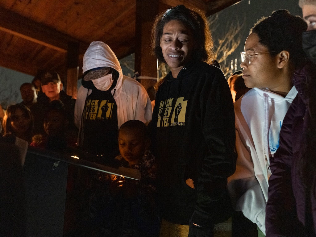 (Leah Hogsten | The Salt Lake Tribune) Brittany Tichenor-Cox, center, reacts as her son Jackson says a few words about his sister Izzy Tichenor, Nov. 9, 2021. Hundreds mourned the death of 10-year-old Isabella "Izzy" Tichenor during a vigil at Foxboro Hollow Park in North Salt Lake on Tuesday.