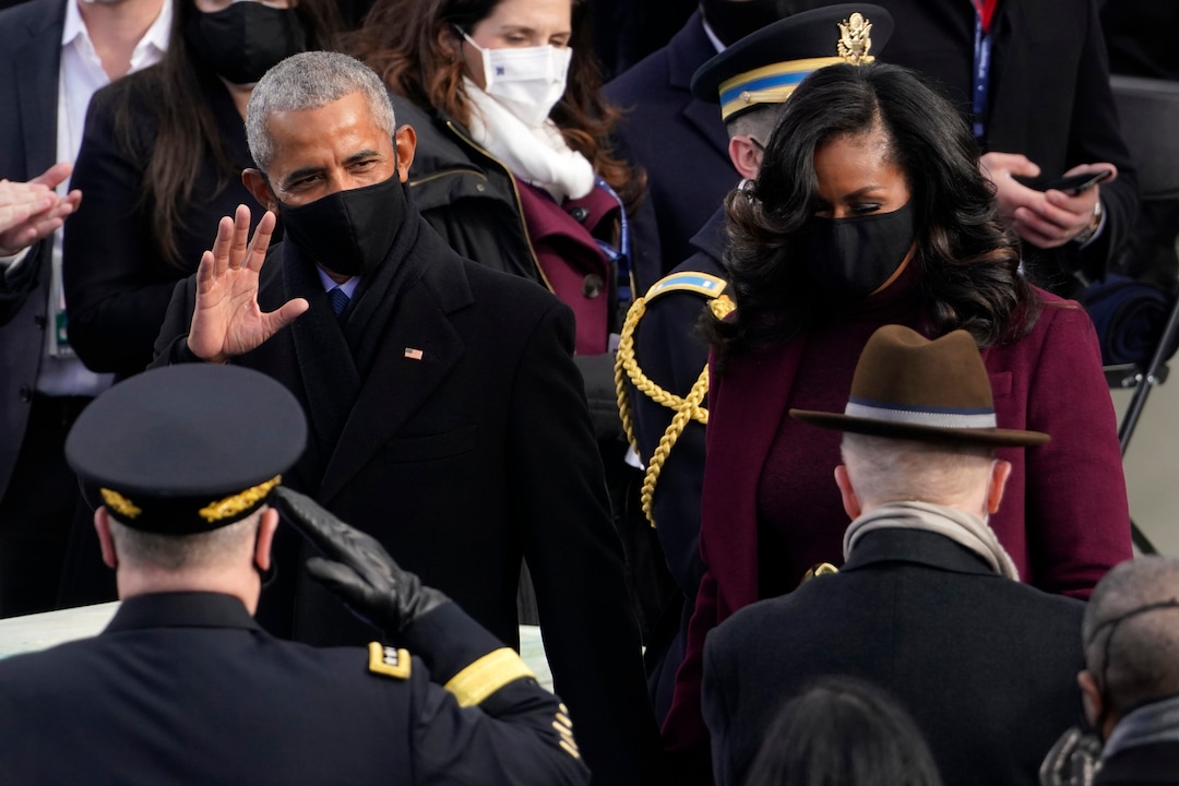 Former President Barack Obama and his wife Michelle arrive for the 59th Presidential Inauguration at the U.S. Capitol for President-elect Joe Biden in Washington, Wednesday, Jan. 20, 2021. (AP Photo/Andrew Harnik)