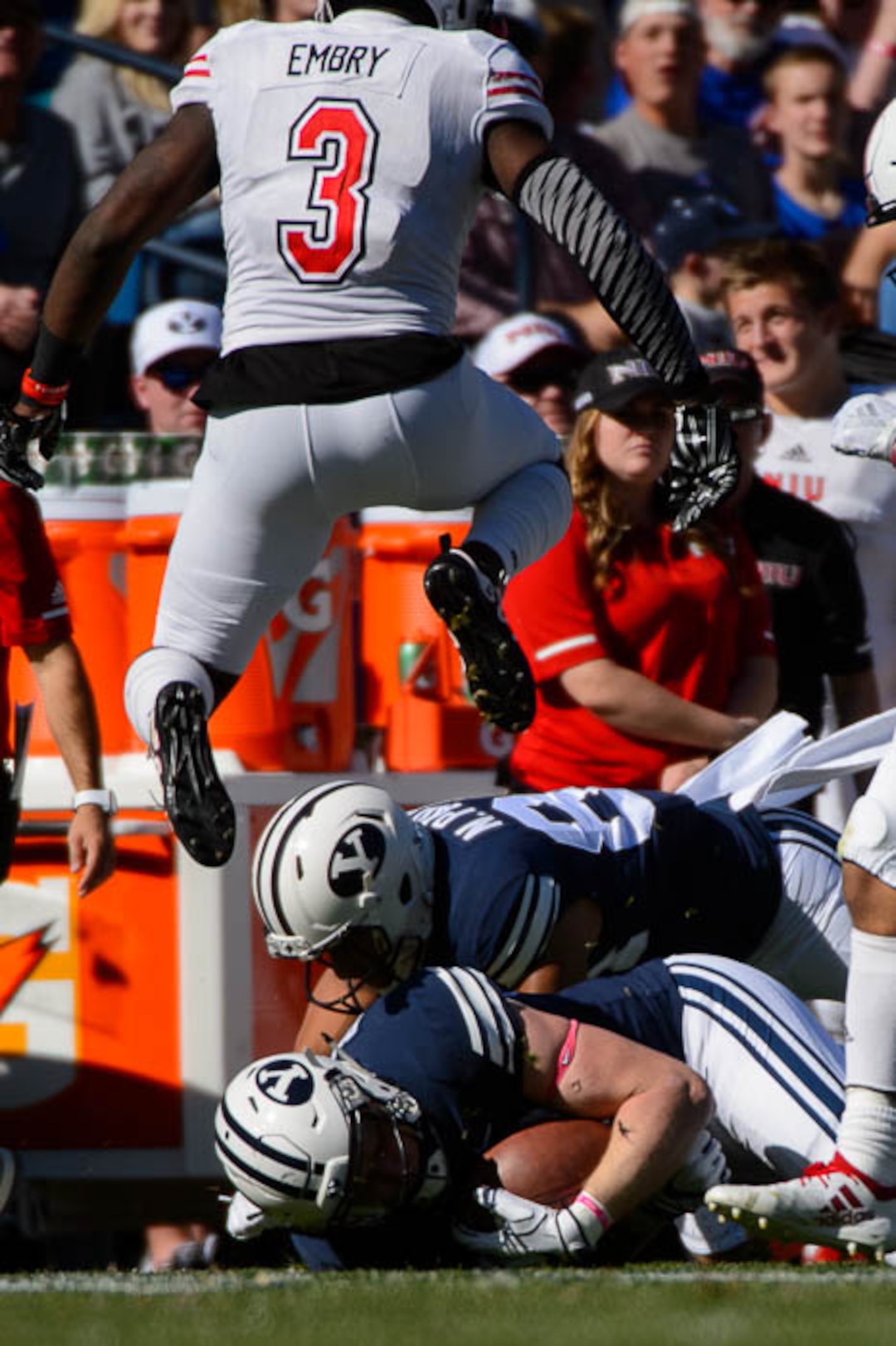 (Trent Nelson | The Salt Lake Tribune)  Northern Illinois Huskies cornerback Jalen Embry (3) leaps over Brigham Young Cougars tight end Matt Bushman (89) as BYU hosts Northern Illinois, NCAA football in Provo, Saturday Oct. 27, 2018.
