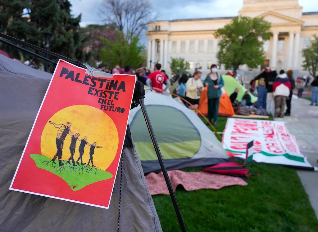 (Bethany Baker | The Salt Lake Tribune) A sign hangs from a tent during a pro-Palestine rally at the University of Utah in Salt Lake City on Monday, April 29, 2024.
